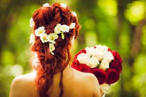 red headed bride holding flowers