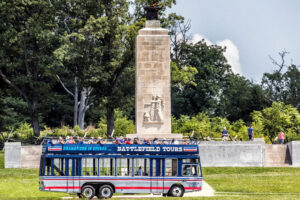 Gettysburg Battlefield Tours double decker bus driving past a monument