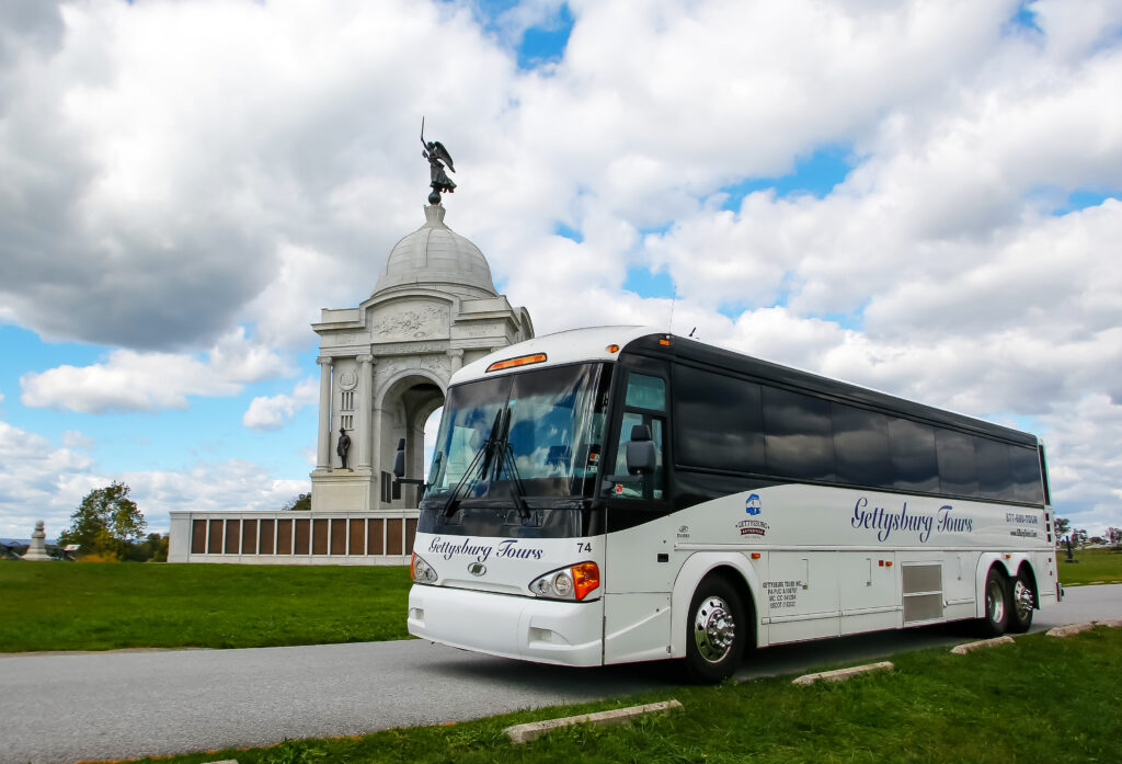 Air Conditioned Coach for Gettysburg Tours in front of the PA monument